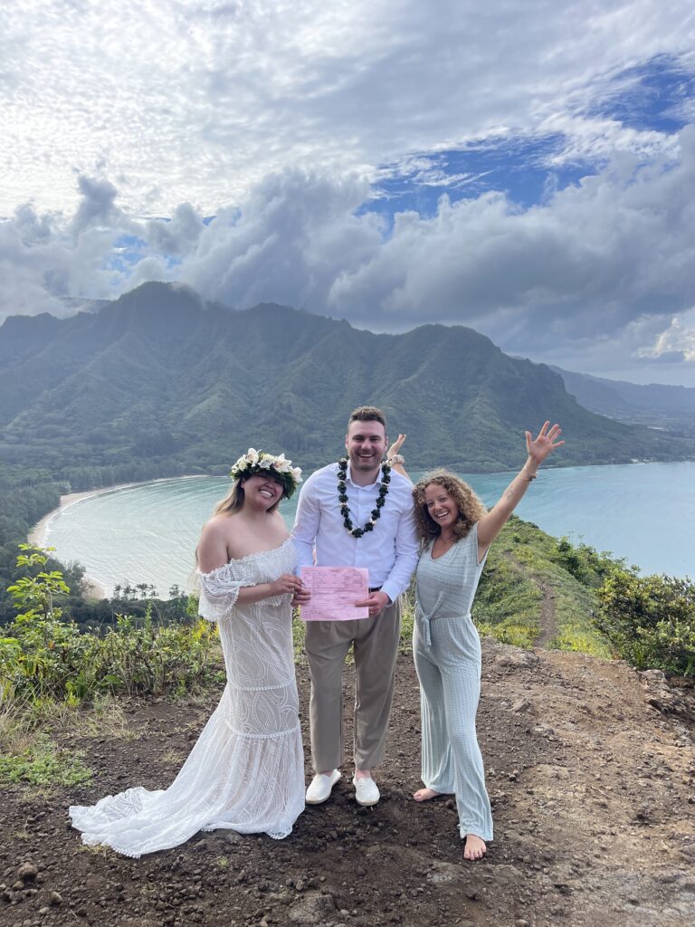Couple elopes in Hawaii on top of mountain with their officiant. 